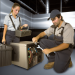 Two professional technicians repairing a commercial ice machine in Waltham, MA, showcasing expert ice machine repair services.